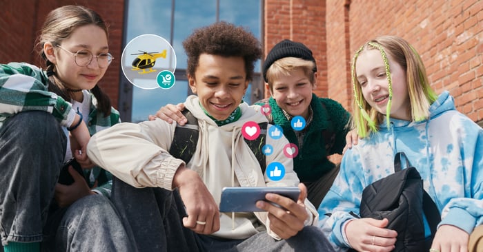 Gen Alpha Students Looking at Phone and Reacting