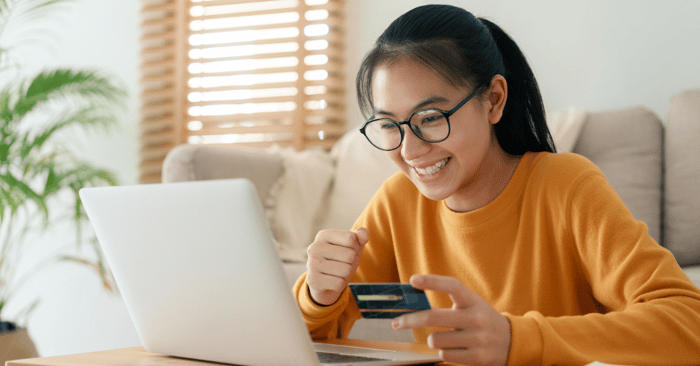 What Brands Need To Know for Prime Day 2025, Girl shopping for amazon prime day items with credit card, online shopping